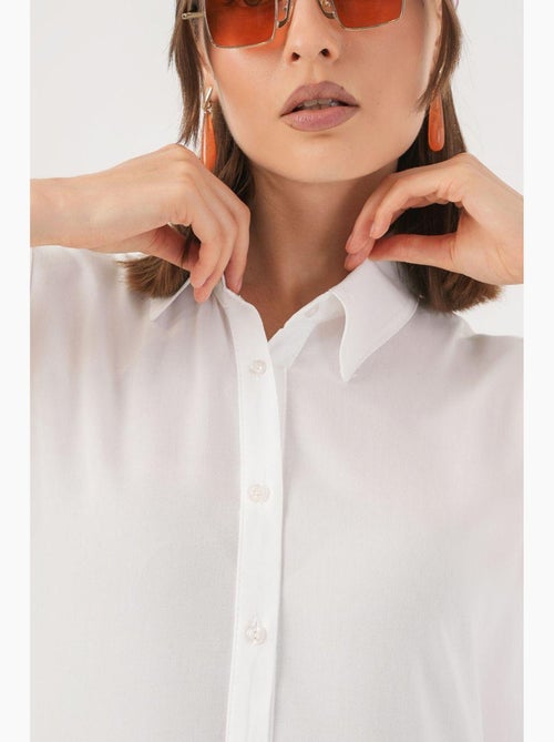 Abito midi senza maniche con bottoni e colletto a camicia bdart - Kiabi Abito midi senza maniche con bottoni e colletto a camicia bdart - Kiabi