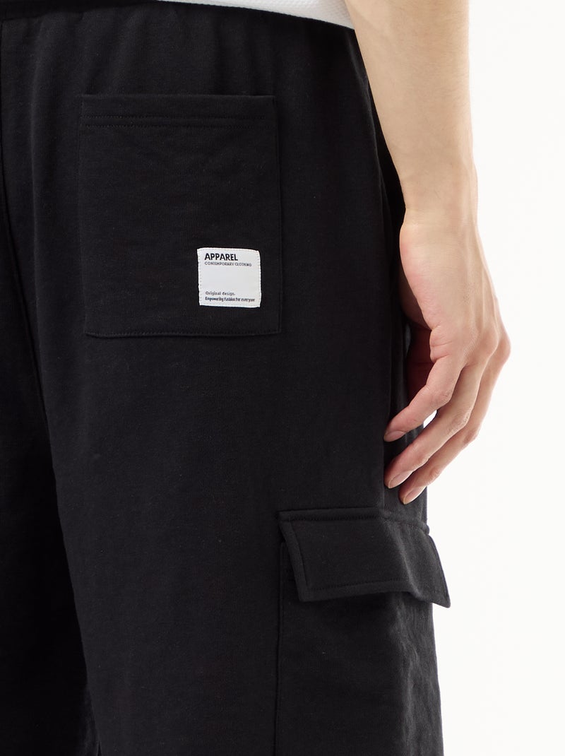 Bermuda in felpa leggera con tasche a patta Nero - Kiabi