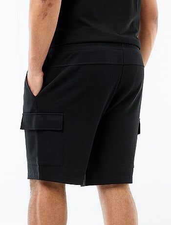 Bermuda in maglia piqué con tasche a patta