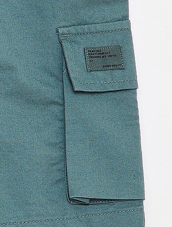 Bermuda tinta unita con tasche con patta