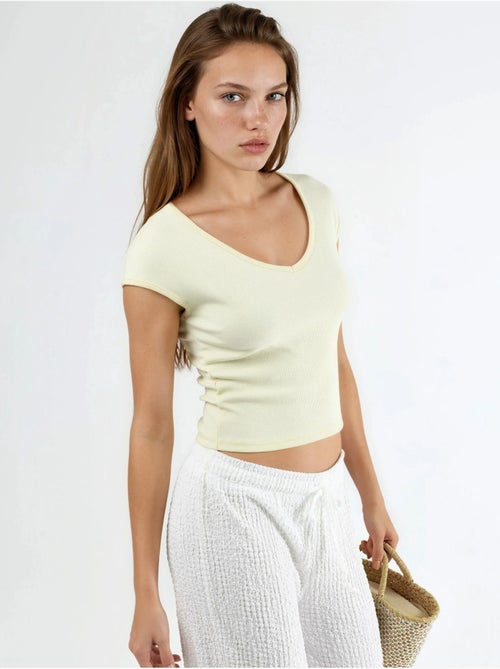 Blusa a coste con scollo a v busem - Kiabi Blusa a coste con scollo a v busem - Kiabi