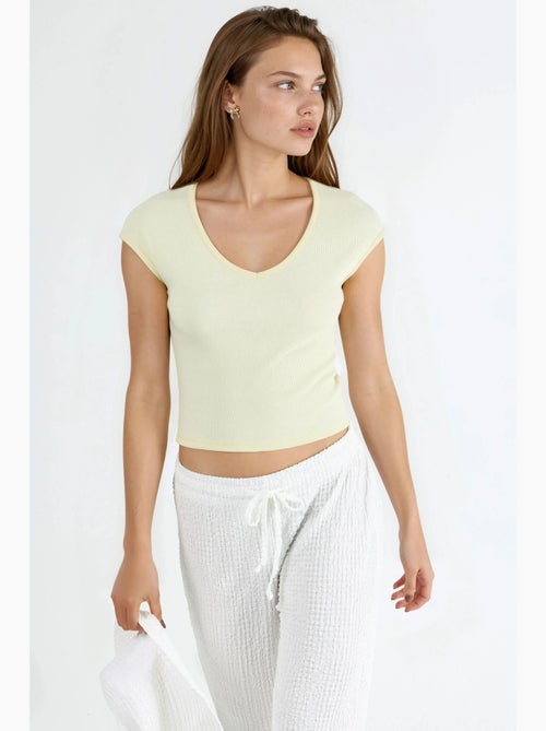 Blusa a coste con scollo a v busem - Kiabi Blusa a coste con scollo a v busem - Kiabi