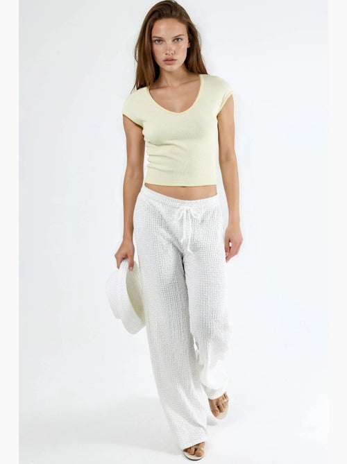 Blusa a coste con scollo a v busem - Kiabi Blusa a coste con scollo a v busem - Kiabi