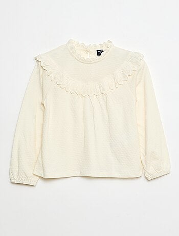 Blusa a maniche lunghe con collo rotondo e plastron con volant e ricami