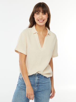 Blusa con colletto a polo in maglia effetto crêpe