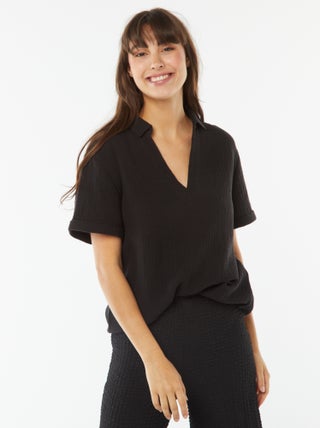 Blusa con colletto a polo in maglia effetto crêpe
