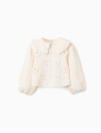 Blusa con maniche a palloncino e applicazione floreale