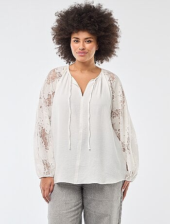 Blusa con maniche lunghe in pizzo e apertura con laccetti al collo