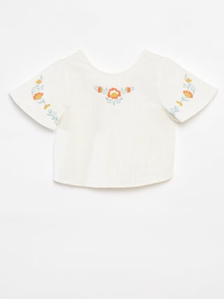 Blusa con motivi ricamati