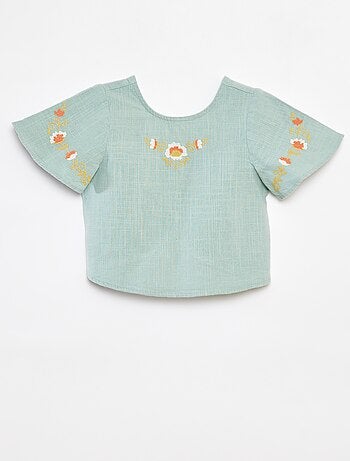 Blusa con motivi ricamati