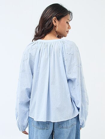 Blusa con ricami floreali