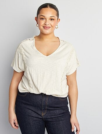 Blusa con ricami in tessuto effetto crêpe