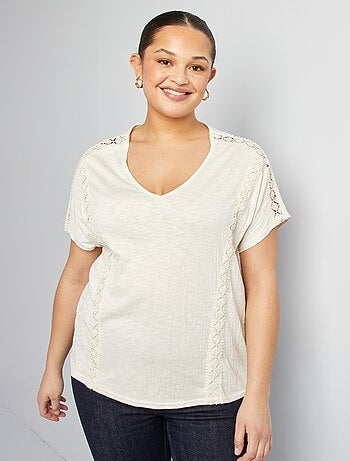Blusa con ricami in tessuto effetto crêpe