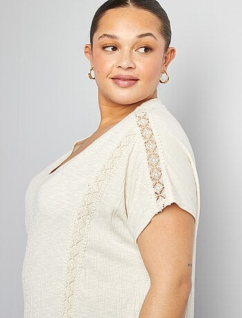 Blusa con ricami in tessuto effetto crêpe