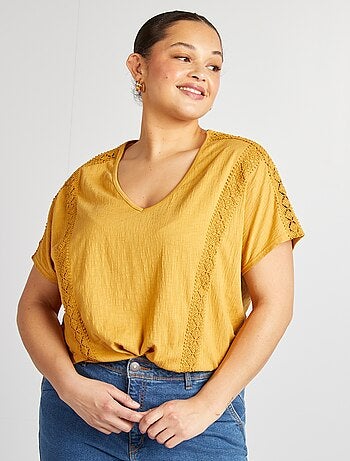 Blusa con ricami in tessuto effetto crêpe