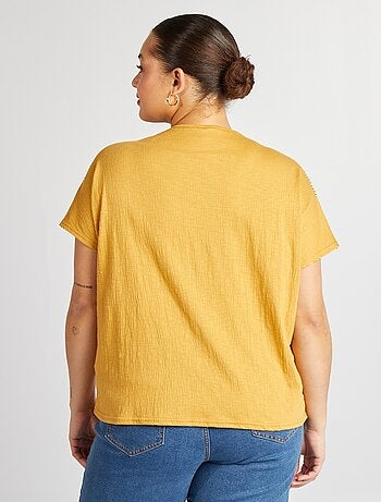 Blusa con ricami in tessuto effetto crêpe