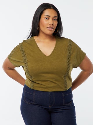 Blusa con ricami in tessuto effetto crêpe