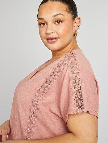 Blusa con ricami in tessuto effetto crêpe