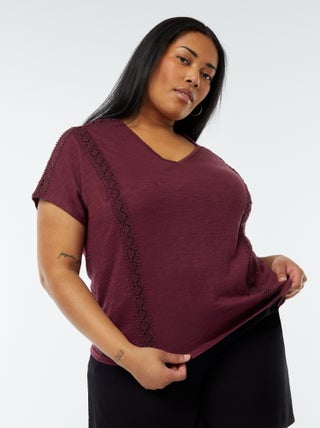 Blusa con ricami in tessuto effetto crêpe
