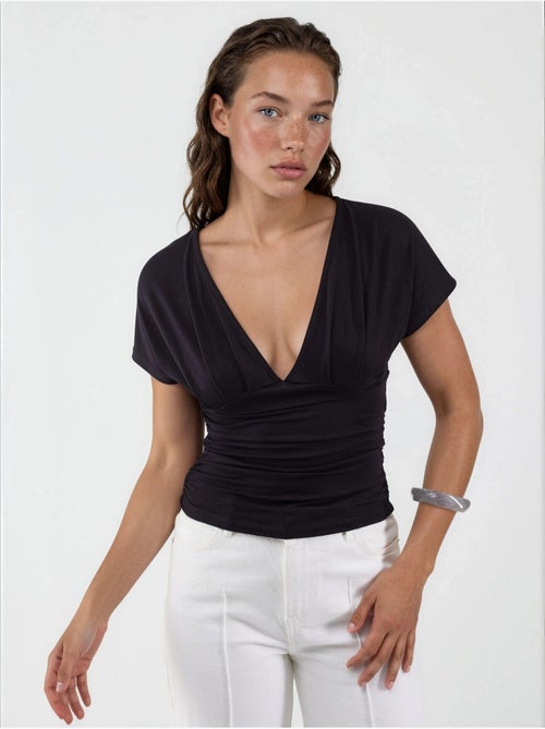 Blusa con scollo a v e dettaglio fiocco busem - Kiabi Blusa con scollo a v e dettaglio fiocco busem - Kiabi