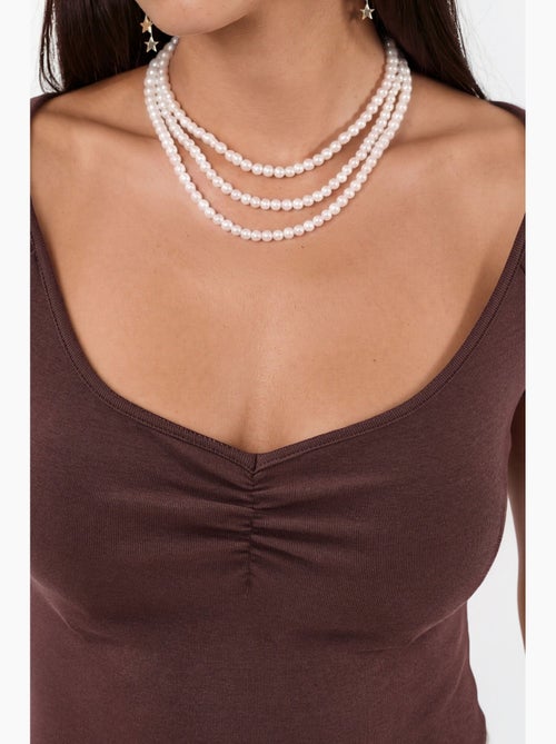 Blusa con scollo a v e maniche corte con drappeggio busem - Kiabi Blusa con scollo a v e maniche corte con drappeggio busem - Kiabi