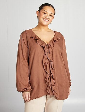 Blusa con volant e apertura con lacci