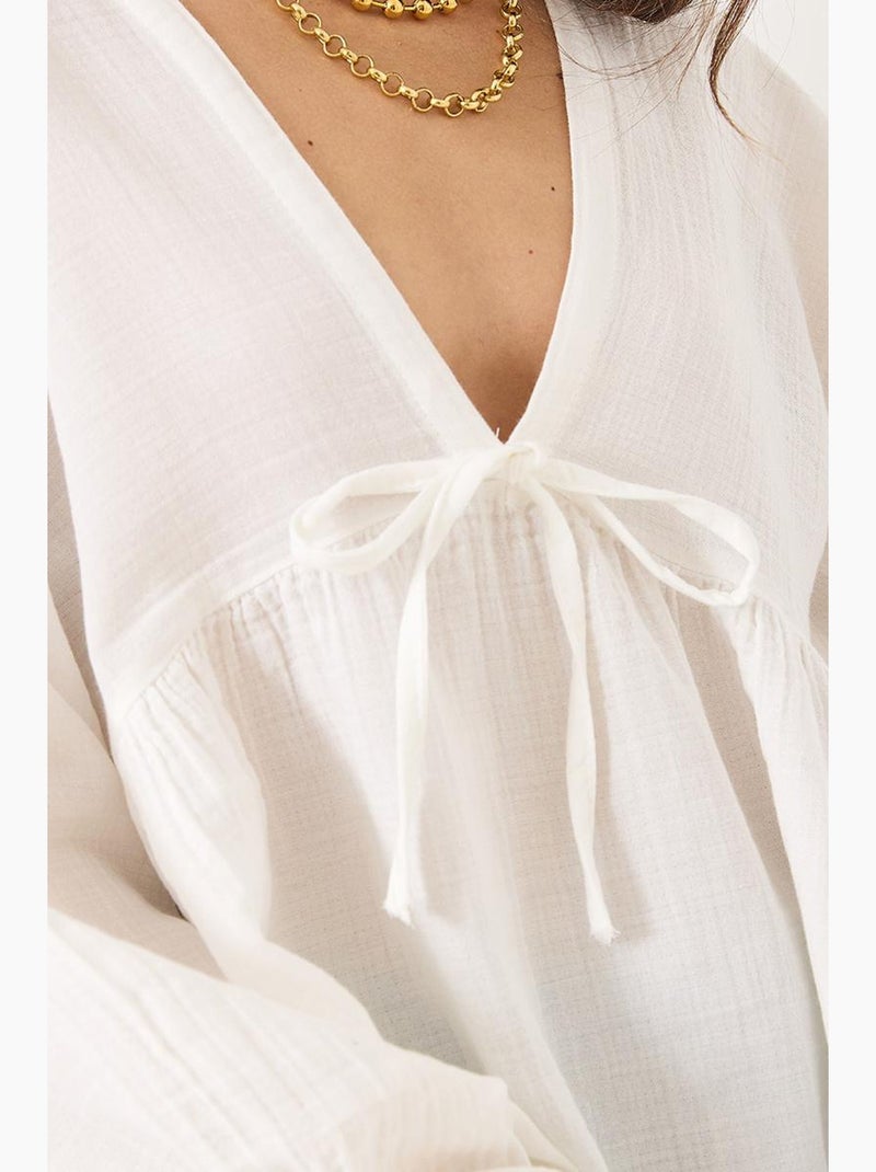 Blusa corta testurizzata scollo a v con fiocco lucci Bianco - Kiabi