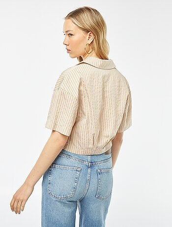 Blusa cropped con apertura incrociata abbottonata