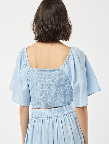 Blusa cropped con fiocco fantasia e maniche a farfalla