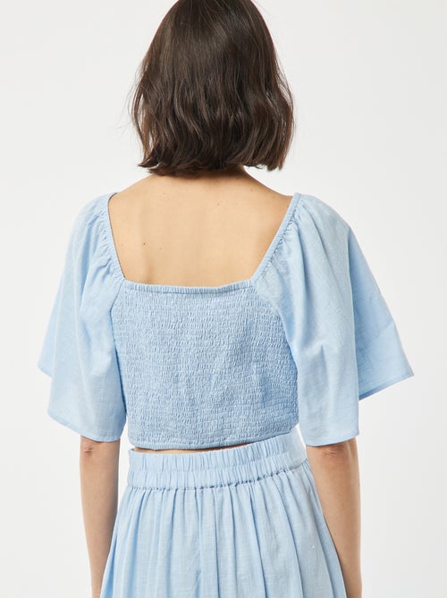 Blusa cropped con fiocco fantasia e maniche a farfalla - Kiabi