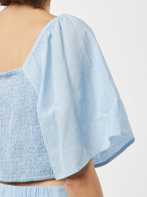 Blusa cropped con fiocco fantasia e maniche a farfalla - Kiabi