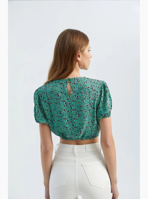Blusa floreale con scollo tondo e coulisse hiccup - Kiabi Blusa floreale con scollo tondo e coulisse hiccup - Kiabi