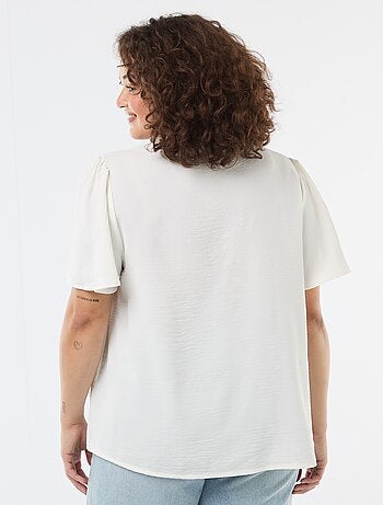 Blusa fluida tinta unita a maniche corte