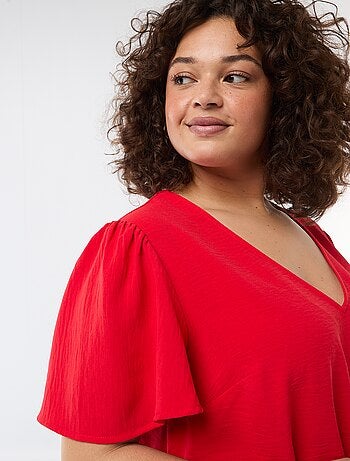 Blusa fluida tinta unita a maniche corte