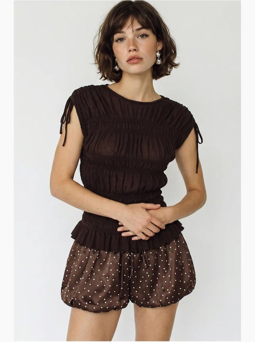 Blusa in maglia aderente senza maniche con dettaglio a laccetto lucci - Kiabi Blusa in maglia aderente senza maniche con dettaglio a laccetto lucci - Kiabi