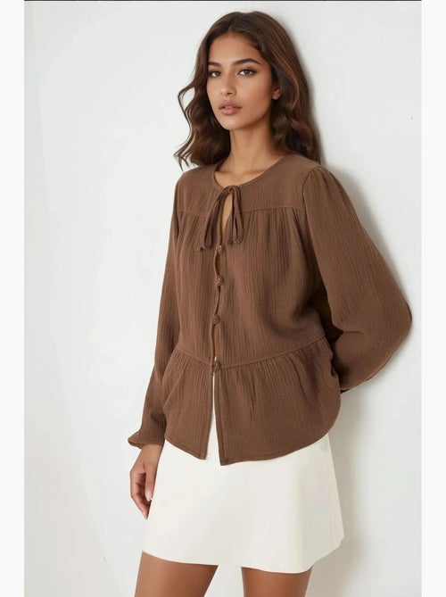 Blusa in mussola tessuta con girocollo e maniche lunghe hiccup - Kiabi Blusa in mussola tessuta con girocollo e maniche lunghe hiccup - Kiabi