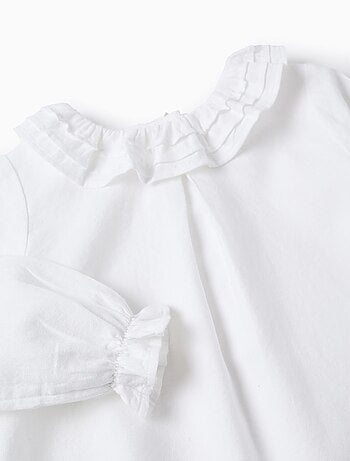 Blusa in saffiano di cotone con volant