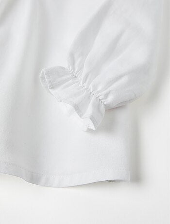 Blusa in saffiano di cotone con volant