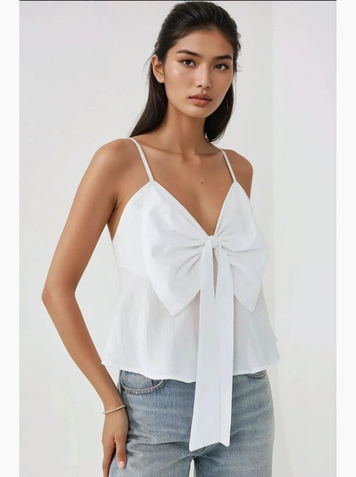 Blusa morbida al tatto con scollo a v e dettaglio fiocco hiccup - Kiabi Blusa morbida al tatto con scollo a v e dettaglio fiocco hiccup - Kiabi