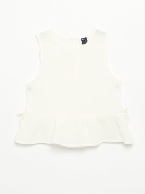 Blusa peplum con fiocchi fantasia - Kiabi