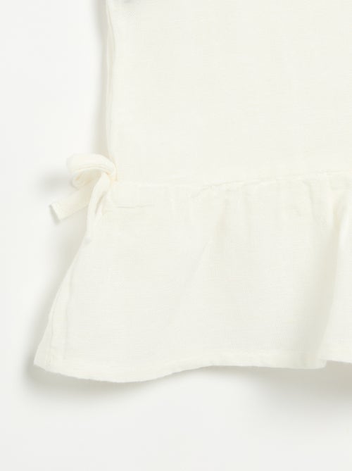 Blusa peplum con fiocchi fantasia - Kiabi