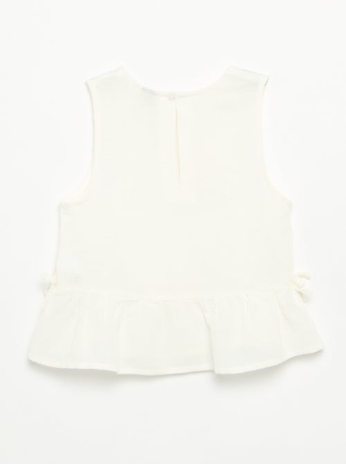 Blusa peplum con fiocchi fantasia - Kiabi