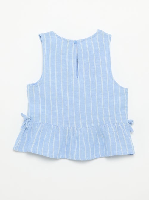 Blusa peplum con fiocchi fantasia - Kiabi Blusa peplum con fiocchi fantasia - Kiabi