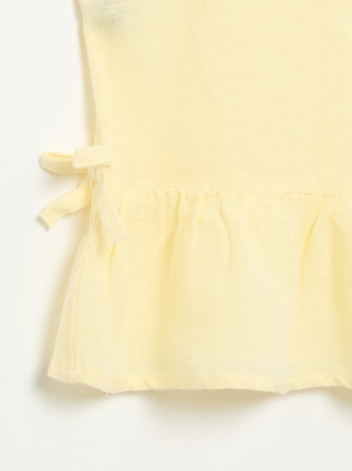 Blusa peplum con fiocchi fantasia - Kiabi