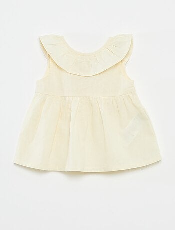 Blusa senza maniche con volant sul davantino