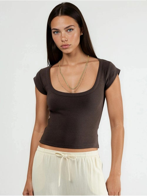 Blusa slim fit a coste con scollo a u busem - Kiabi Blusa slim fit a coste con scollo a u busem - Kiabi