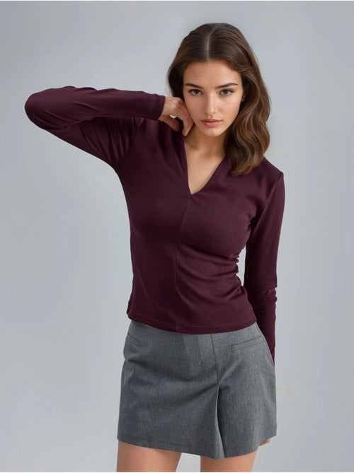 Blusa slim fit a maniche lunghe con scollo a v busem - Kiabi Blusa slim fit a maniche lunghe con scollo a v busem - Kiabi