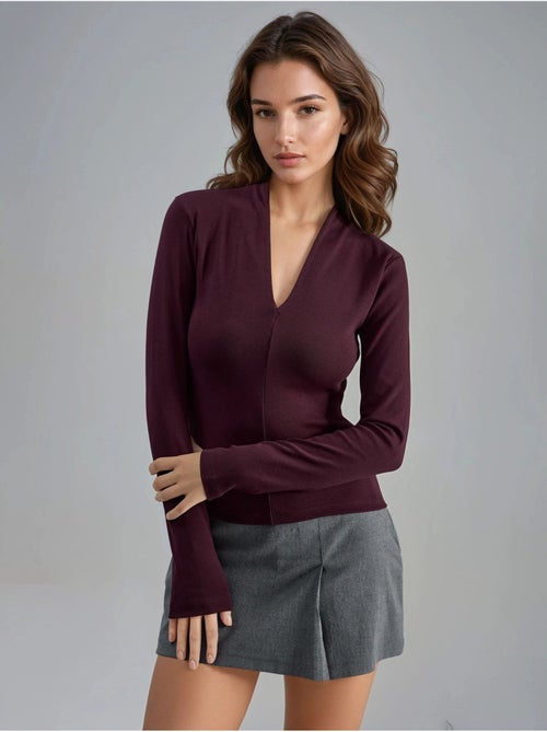 Blusa slim fit a maniche lunghe con scollo a v busem - Kiabi Blusa slim fit a maniche lunghe con scollo a v busem - Kiabi