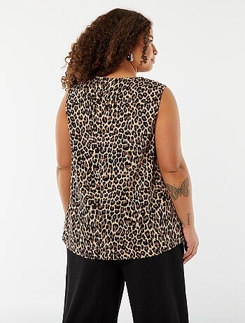 Blusa tinta unita con cucitura fantasia sul collo