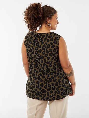Blusa tinta unita con cucitura fantasia sul collo